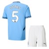 Maglia ufficiale Manchester City Stones 5 Casa 2024-25 per Bambino